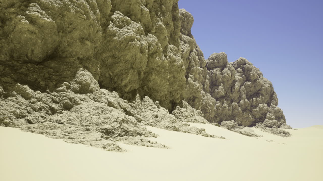 Natures rugged cliffs form a striking contrast with golden sand at midday