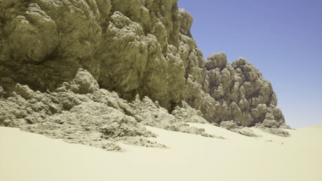 natures rugged cliffs form a striking contrast with golden sand at midday