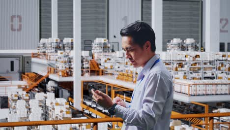 warehouse employee using smartphone