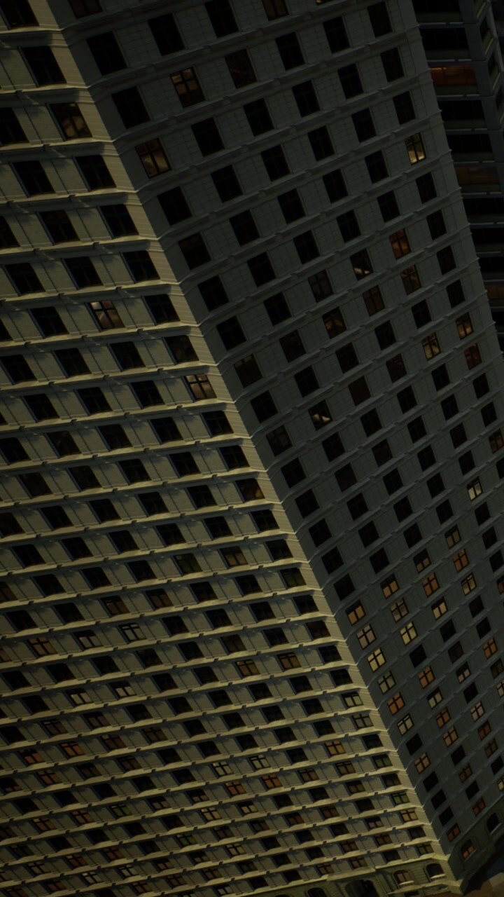 Un edificio alto si erge in un'area urbana