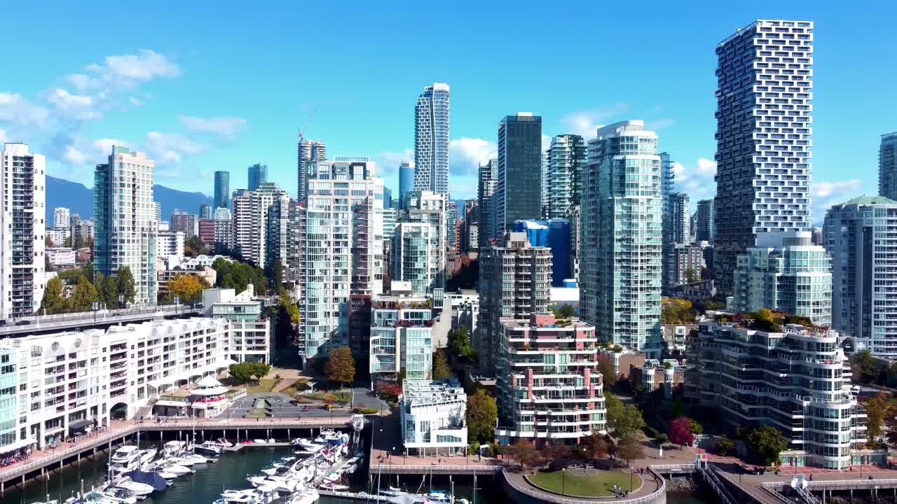 Vancouver waterfront skyline with glass towers in daytime