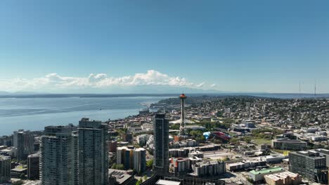 Wide-aerial-view-pushing-towards-the-Seattle-Space-Needle-on-a-warm-summer-day