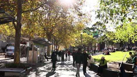 pedestrians walking on a sunny street in melbourne