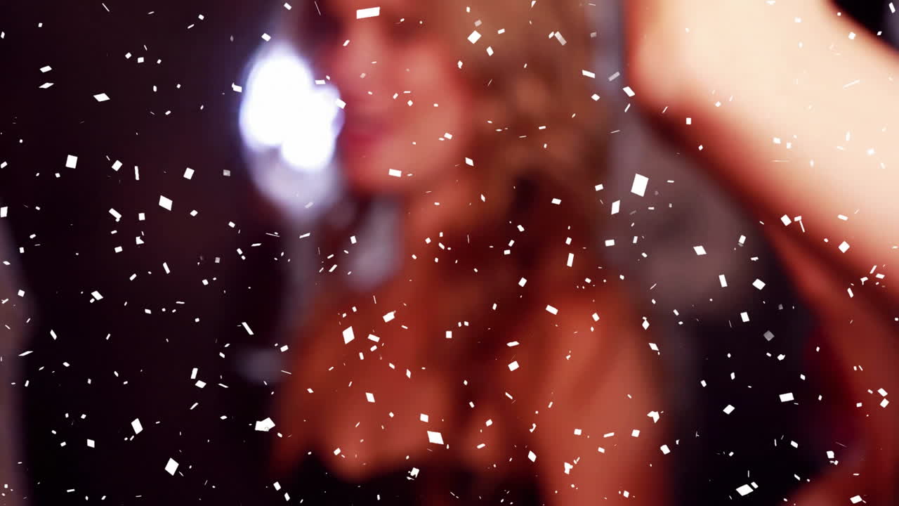 Confetti animation over people celebrating at party
