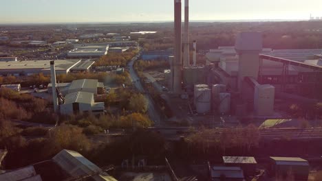 pilkington glass factory warehouse buildings aerial view tilt down over industrial town manufacturing facility