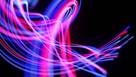 light flow bg in 4k. abstract looped background with light trails, stream of red blue neon lines in space move to form looped spiral shapes. modern trendy motion design background.