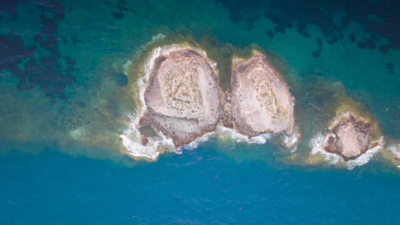Aerial top down view of Punta de El Toro limestone archipelago, Mallorca