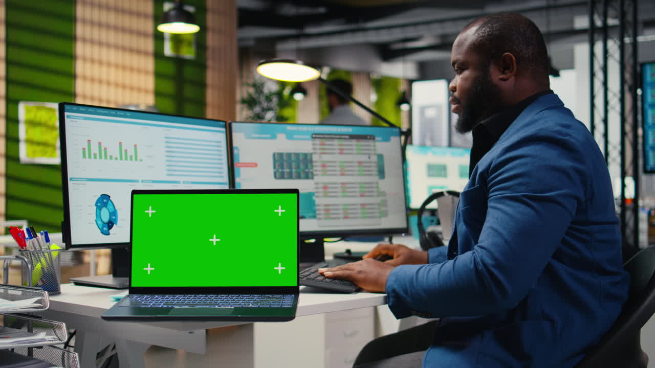 Vertical Video Male advisor analyzing KPI metrics with isolated copy space on laptop