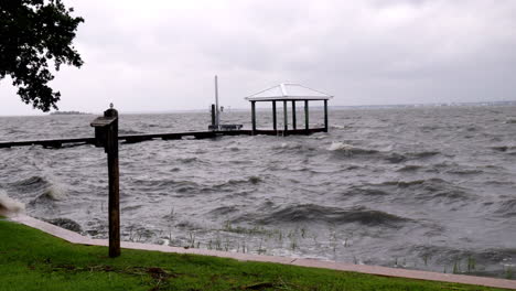 Wide-shot-of-waves-splashing-over-a-dock-from-a-hurricane-storm-surge