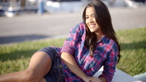 Girl-Relaxing-On-Bench-In-The-Park