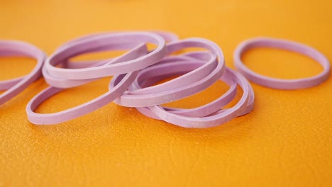 pile of purple rubber bands