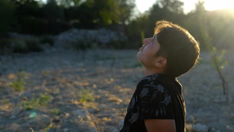 man sitting outdoors looking sky