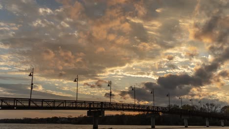 sunset over a pier bridge
