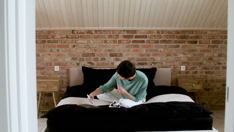 Woman-doing-videocall-on-the-bed