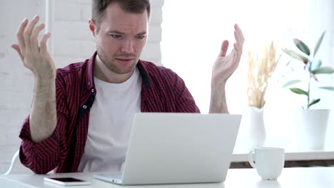 Loss, Frustrated Young Man Working on Laptop