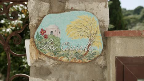 close up shot of a beautiful handmade sign on the roads of capri, in italy - 01