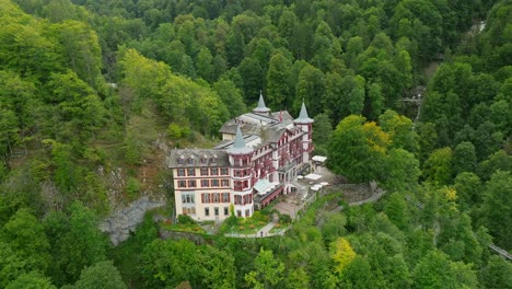 aerial view of the giessbach hotel and waterfall