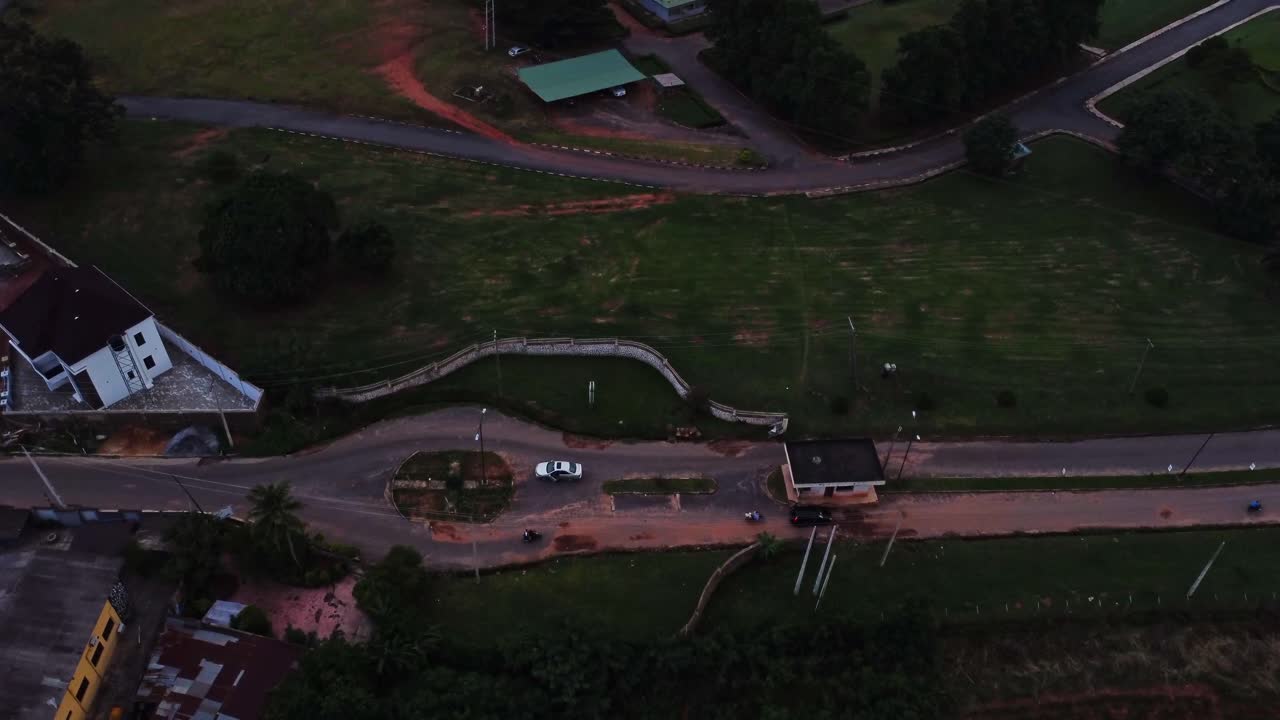 Aerial of a busy road on the outskirts of a town in Nigeria, Africa