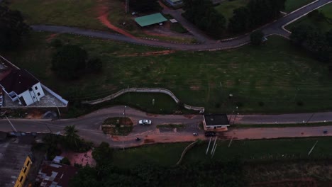 aerial of a busy road on the outskirts of a town in nigeria, africa