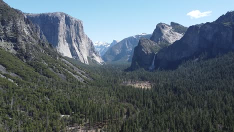 beautiful mountain grandeur postcard scenery of yosemite national park, usa. slow aerial approach towards bridal veil falls from the famous tunnel view overlook.