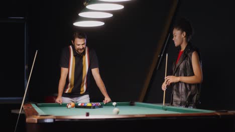 couple playing pool