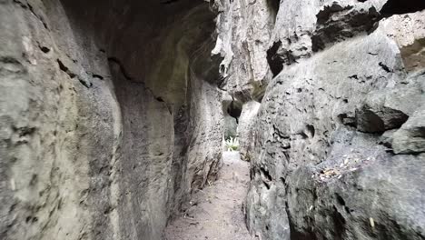 Moving-into-strange-rock-formations-in-Rammang-Rammang,-Makassar,-Indonesia