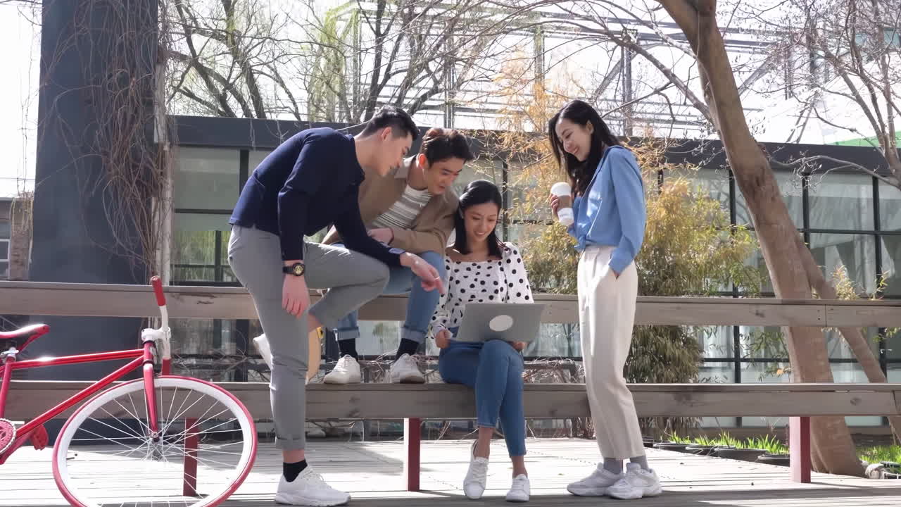 Marketing business team collaborating on project, colleagues businessman and businesswoman outside office building discussing current plans, management, looking at laptop screen, get consulting