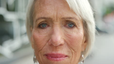 closeup portrait of a mature woman face against