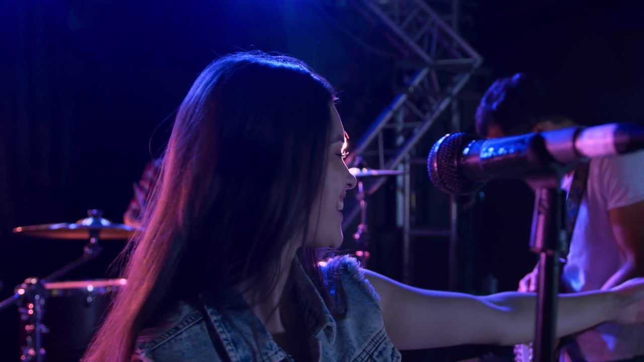 Female musician singing during a concert