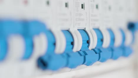 man flipping a single circuit breaker switch on and off