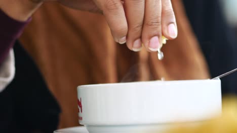 squeezing fresh lemon juice into a bowl