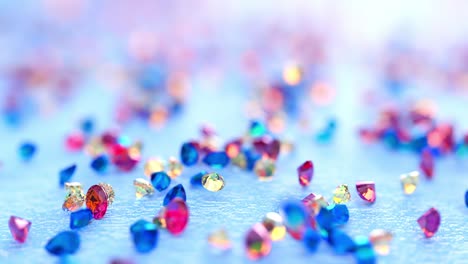 topaz rain. pink, yellow and blue topaz falling on light blue background