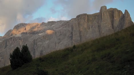 walking down the trail in dolomites, val gardena, mountaineering in italian alps