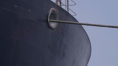 Mooring-Hawser-Through-Fairlead-Of-A-Huge-Cargo-Ship-Near-The-Port