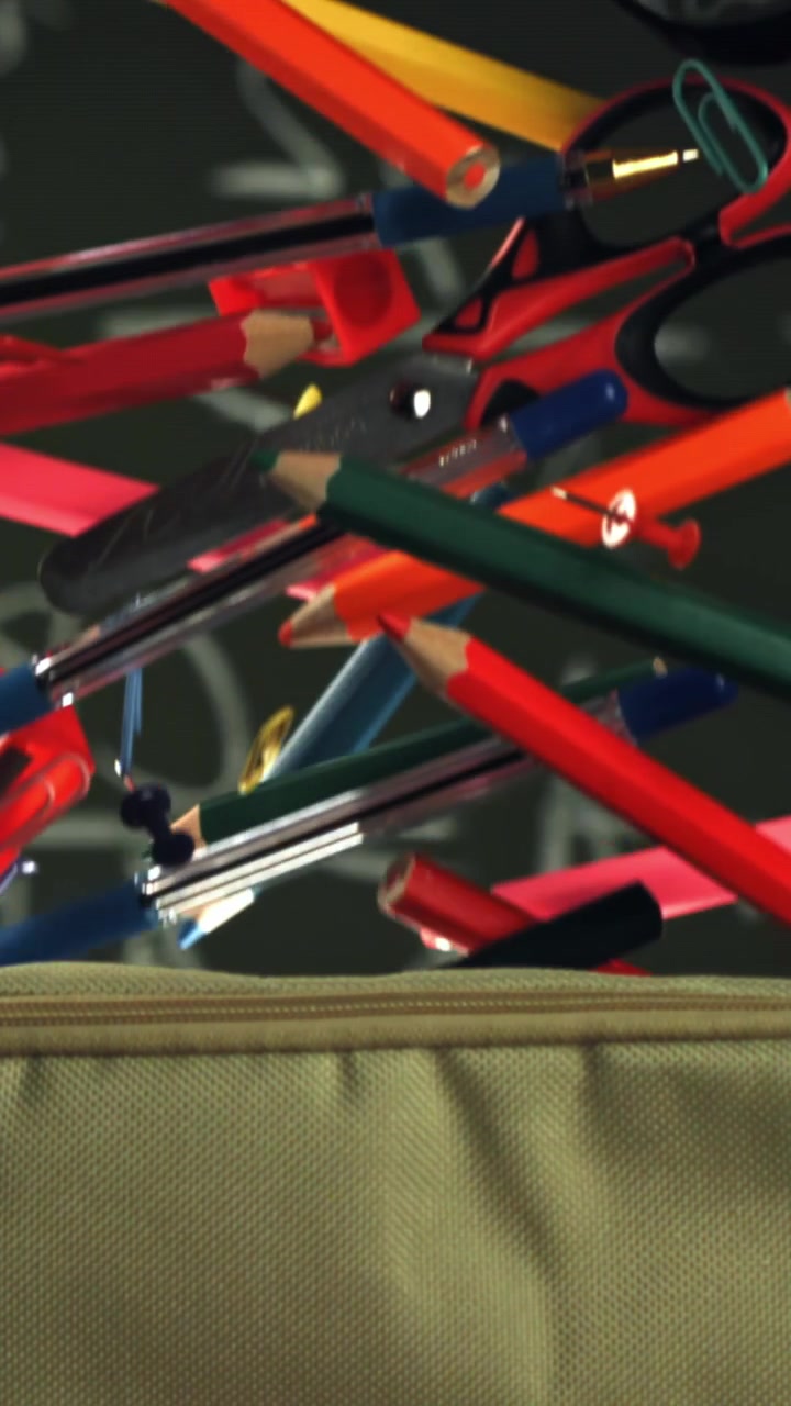Colorful School Supplies Falling into a Pencil Case