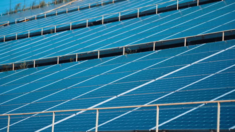 solar panels stand in a row in the fields of green energy landscapes. alternative sunlight energy technology.
