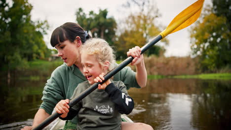 kid, mother rowing and kayak in lake on holiday