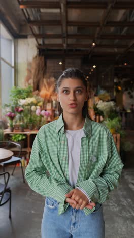 woman speaking in a flower shop cafe