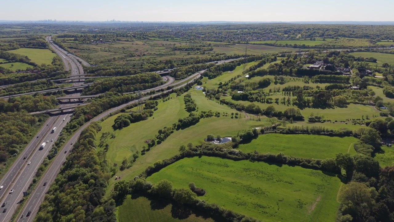 Busy Highway Interchange and Vehicles in Green Rural Landscape