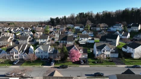 aerial establishing shot of luxury new homes in suburb of american town