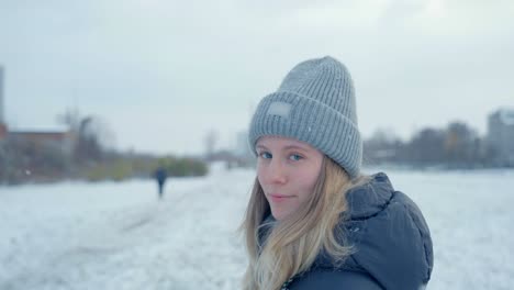 a girl walking in front of camera in husky snow siberia