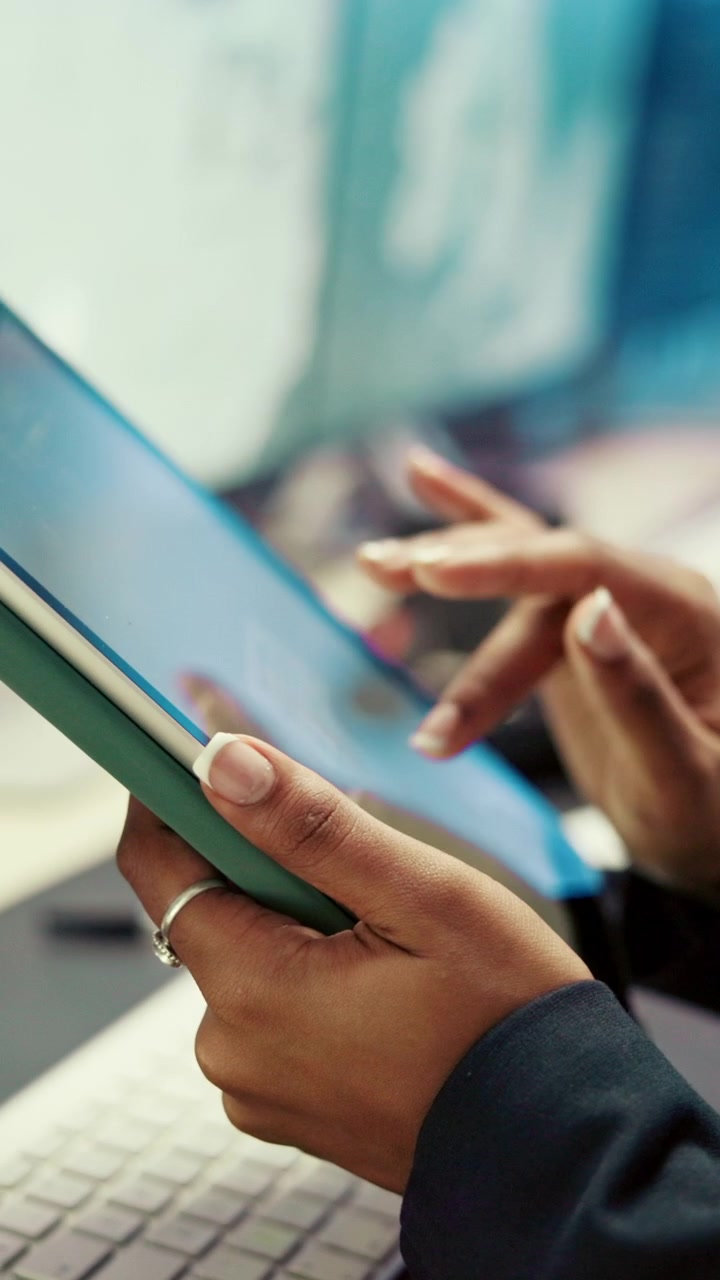 Businesswoman Using Tablet Computer in Modern Office