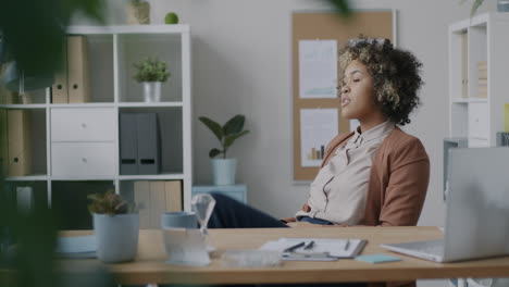 woman sitting at her desk in office