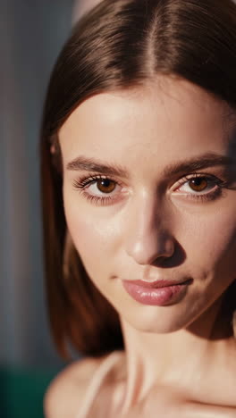 close-up portrait of a young woman in warm light