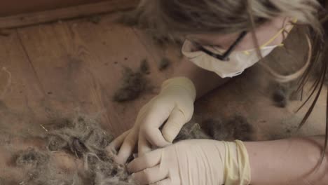 woman wearing disposable dust mask collecting dust samples