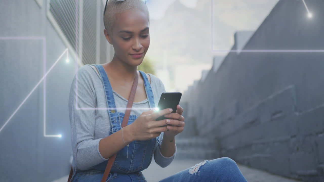 Animation of light trails over biracial woman using smartphone