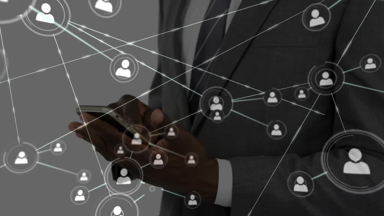 Business executive tapping smartphone and expanding user-icon network showing business connectivity