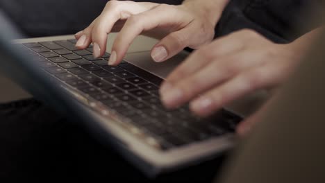 Close-up-of-female's-hands-typing-on-laptop