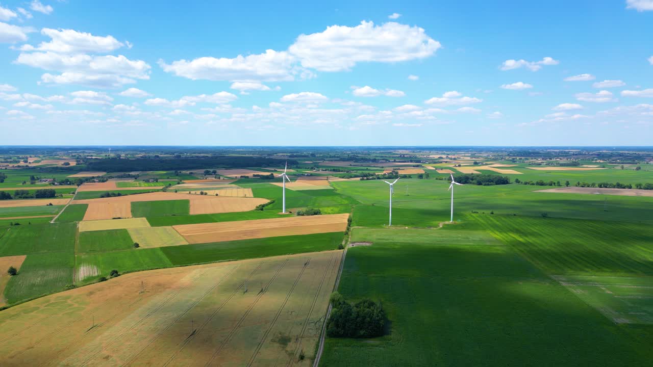 Aerial view of powerful Wind turbine farm for energy production on beautiful cloudy sky at highland