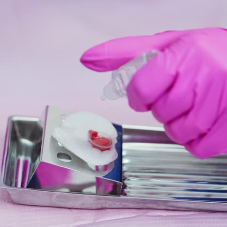 beautician prepares color for micropigmentation. medical equipment for permanent makeup on lips. close-up.